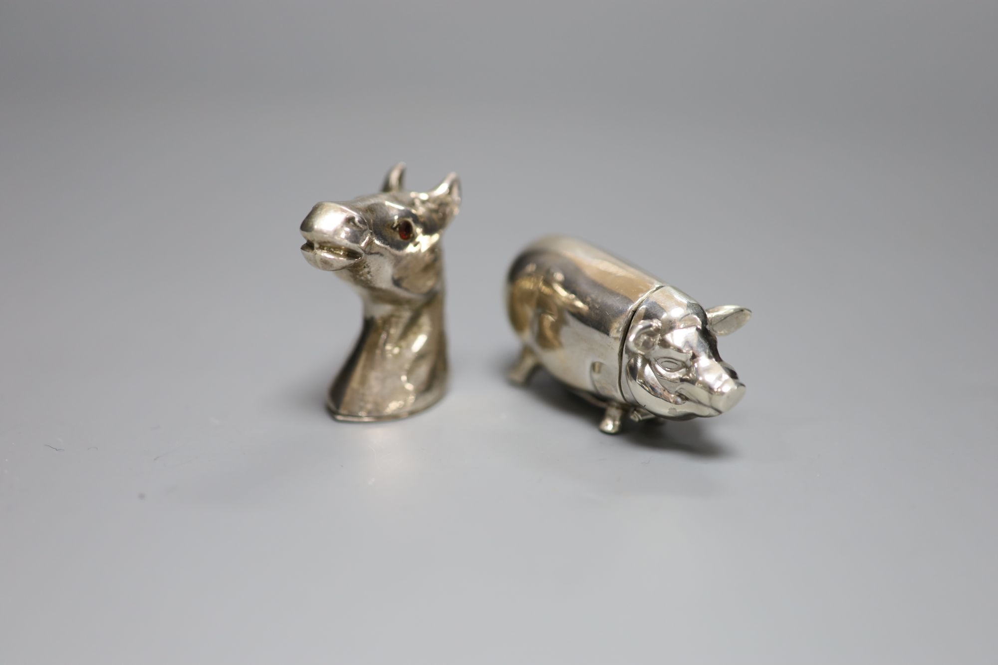 Two modern 925 vesta cases, pig and horses head, pig 65mm.
